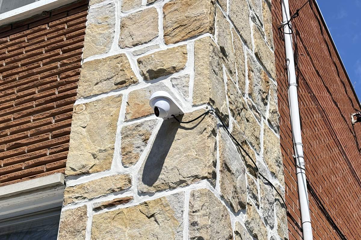 Surveillance camera installed on a commercial building